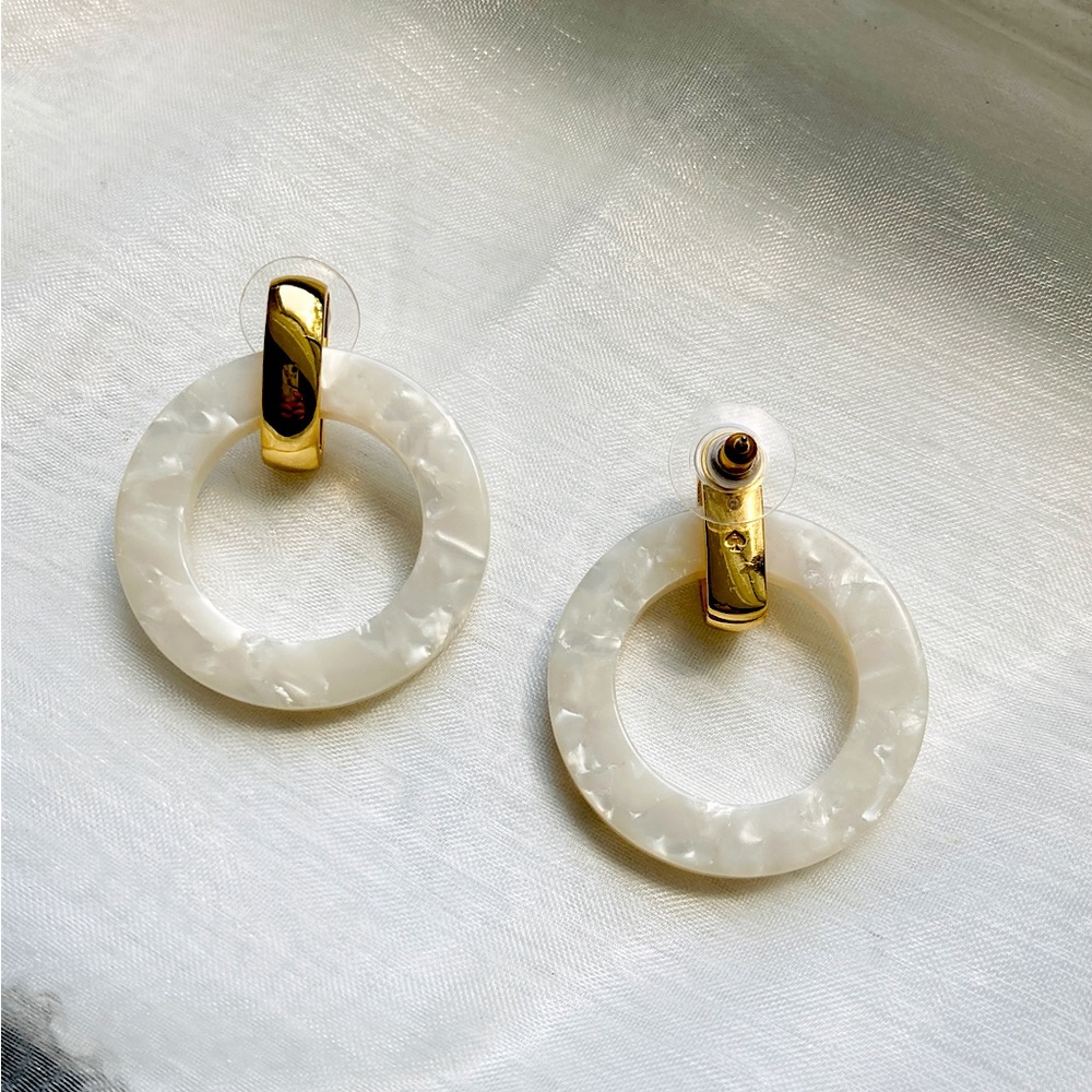 Kate spade earrings mother of pearl and gold dangle hoops.